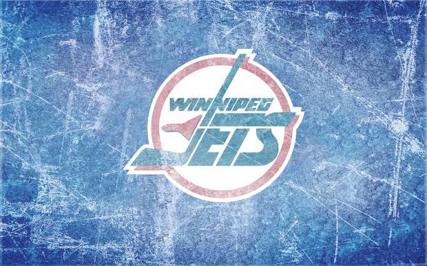 Exciting Winnipeg Jets Game on Home Ice Rink Wallpaper