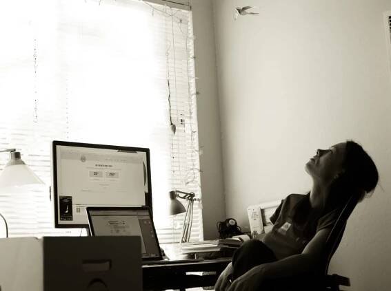 lady daydreaming at desk