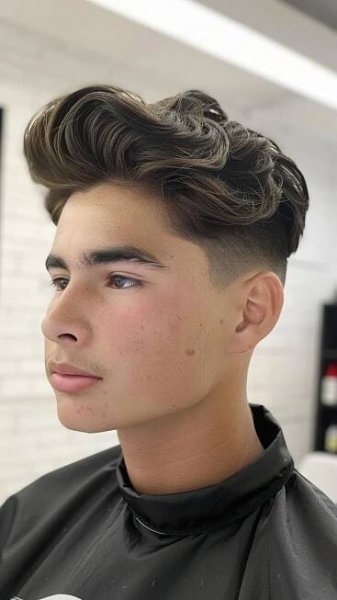A man modelling a pompadour undercut.