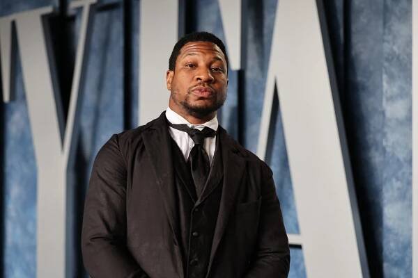Jonathan Majors in 'Freedom' Cap As He Leaves Court on Assault Charges