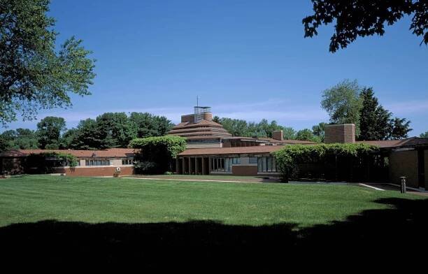 Wright's Wingspread, the Herbert F. Johnson House, is organically low to the ground, brick, and with a central chimney