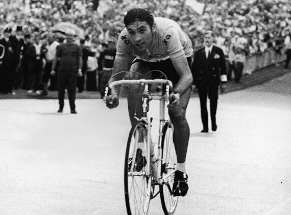 Belgian cyclist Eddy Merckx arrives at Vincennes in the final stage of the Tour de France as spectators cheer him on, Vincennes, France, mid 1969. This would be the first of five victories for Merckx at the Tour de France. (Photo by Agence France Presse/Getty Images)
