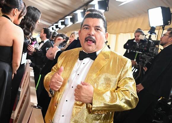 Guillermo Rodriguez in a gold suit at the 97th Oscars in Hollywood, California