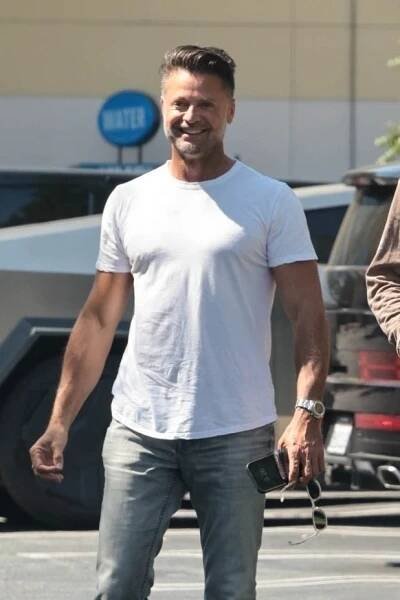David Charvet smiling while walking.