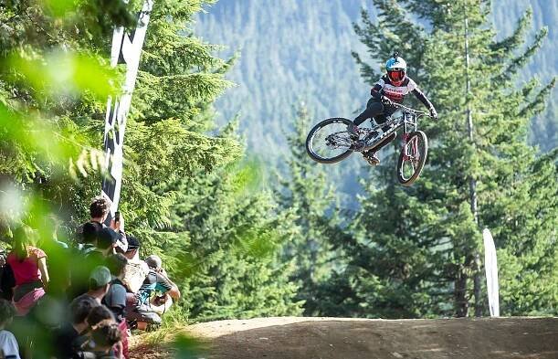 Visual Casey Brown in air on mountain bike