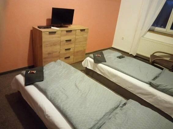 Postel nebo postele na pokoji v ubytování Penzion Prajzko, Hronov