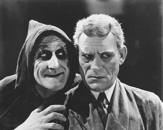 George Austin as Rigo (left) and Lon Chaney as Dr. Ziska (right) in The Monster  (1925).