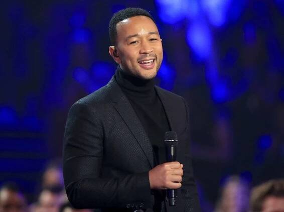 John Legend speaks on stage during the 2018 E! People's Choice Awards held at the Barker Hangar on November 11, 2018