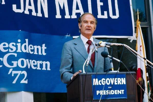 Image may contain George McGovern Audience Human Crowd Person Speech Tie Accessories Accessory and Lecture