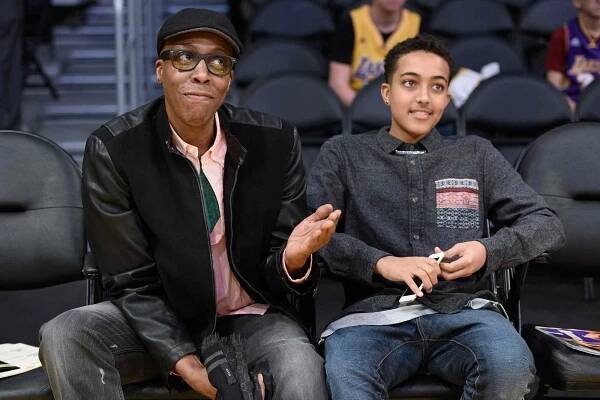 Arsenio Hall and his son Arsenio Hall Jr attend a basketball game between the Los Angeles Clippers and the Los Angeles Lakers on December 25, 2015 in Los Angeles, California. 