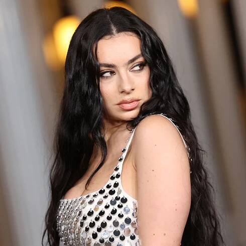 Charli XCX Is an Indie Sleaze Inspiration in a Stained Tank Top, Jorts, and $3,000 Boots