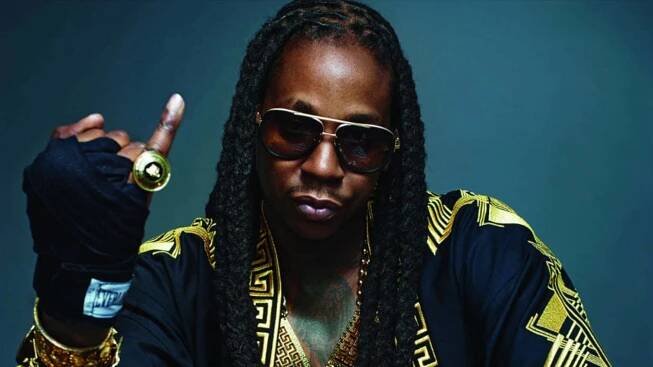 A Man With Dreadlocks And Gold Jewelry