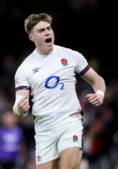 Tommy Freeman of England celebrating a try.