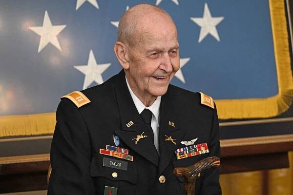 Former US Army Captain Larry Taylor listens to US President Joe Biden speak before presenting him the Medal of Honor