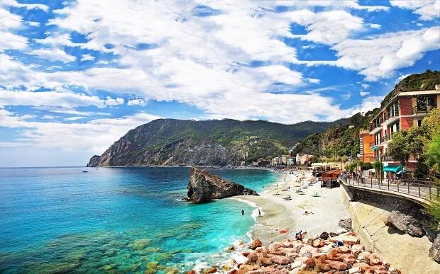 A breathtaking view of the Italian coastline at sunset Wallpaper