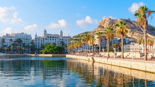 Beautiful waterfront promenade with palm trees in Alicante, Spain