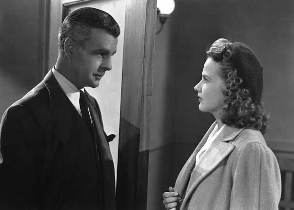 WHEN STRANGERS MARRY, (aka BETRAYED), from left: Neil Hamilton, Kim Hunter, 1944