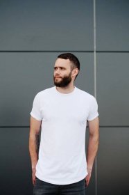 low fade haircut brunette closely shaven beard