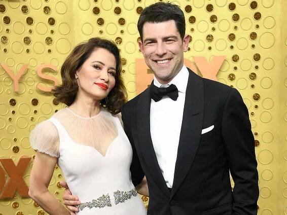 Tess Sanchez and Max Greenfield at the 71st Emmy Awards in 2019.