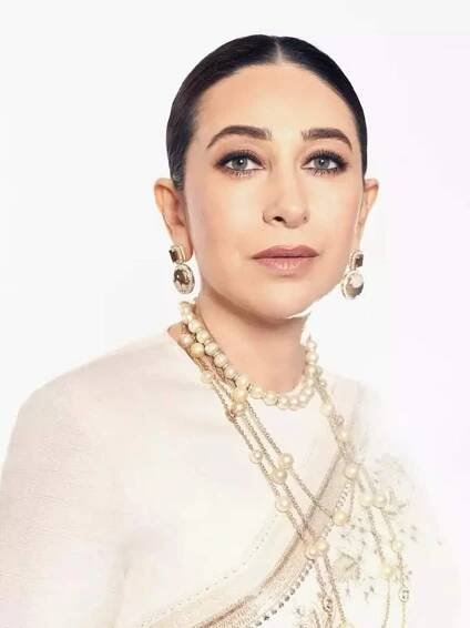 Karisma Kapoor is a true vision of elegance in pearl white saree