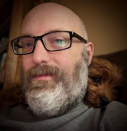 Dr. Jason Jeffrey Jones with Zookie the dog