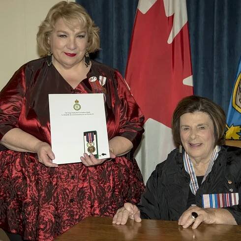 Photo of the Honourable Anita R. Neville and Paulette Lynne Marie Duguay accepting the King Charles III Coronation Medal