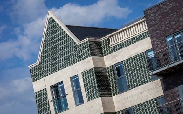 Green glazed brick commercial building in Swansea