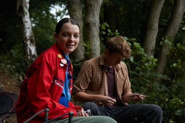 KEY STILL - Esme Creed-Miles and Tom Varey in POND LIFE (fishing)