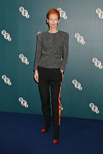 Image may contain Tilda Swinton Human Person Fashion Clothing Apparel Premiere and Sleeve
