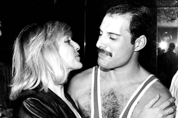 Freddie Mercury of British rock band Queen with Mary Austin, during Mercury's 38th birthday party at the Xenon nightclub, London, UK, September 1984.