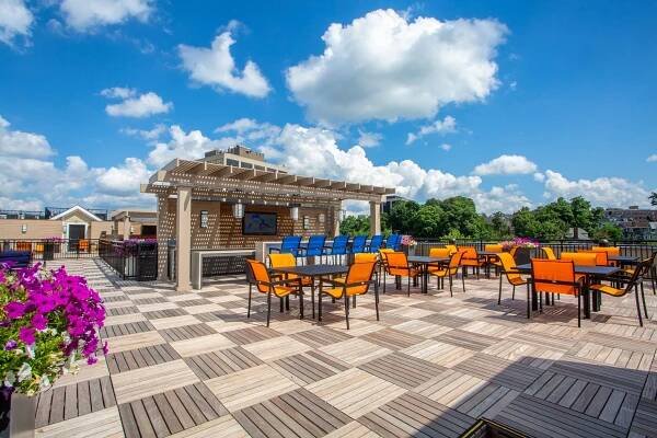 Modera 55 rooftop space with blue accent chairs