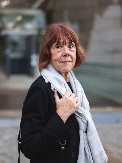 A photo of Gisèle Pelicot looking at the camera.