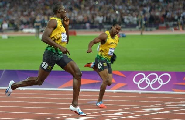 Usain Bolt and Yohan Blake celebrating after a 200m race.