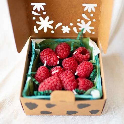 Raspberry Birthday Candle Set of 10 shown in carton from above
