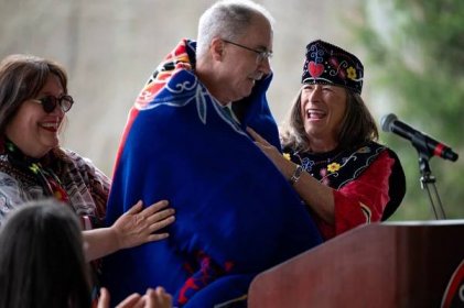 Chief Many Hearts Dr. Lynn Malerba and Medicine Woman Melissa Tantaquidgeon Zobel of the Mohegan Tribe drape a custom Mohegan Pendleton blanket over Dartmouth College President Philip J. Hanlon during a repatriation ceremony where handwritten papers of 18th century Mohegan scholar Samson Occom were returned to the Mohegan Tribe. Occom traveled to Europe in the 1760s to raise funds for a school in Connecticut for Native American students — but after he returned, he learned that the funds were instead diverted towards the founding of a school for white settlers. Dartmouth experts say the papers contain what is believed to be the earliest example of written Mohegan language.