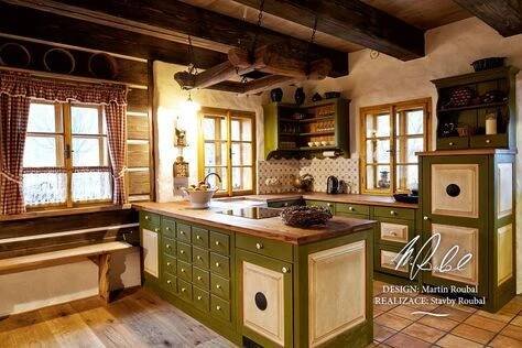 an old fashioned kitchen with green cabinets and wood flooring is pictured in this image