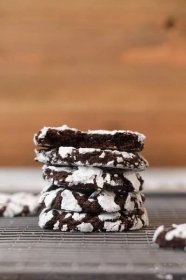 Chocolate Crinkle Cookies are the ultimate delicious, fudge-y cookies. They're thick and rich with soft baked centers and a sweet powdered sugar coating. #dessert #cookies #chocolate #chocolatecookies #crinklecookies #powderedsugar #christmas #holiday #dinnerthendessert