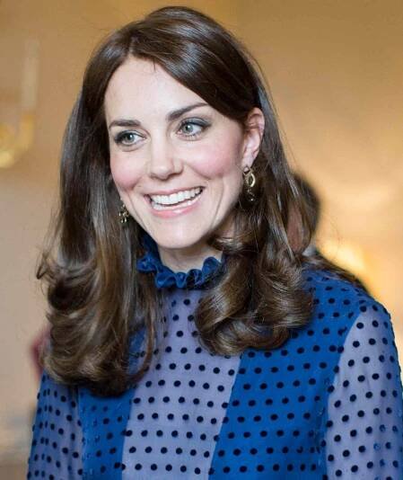 Catherine, Duchess of Cambridge, talks to guests at a reception at Kensington Palace, London, on the April 6, 2016 ahead of their tour of India and Bhutan.