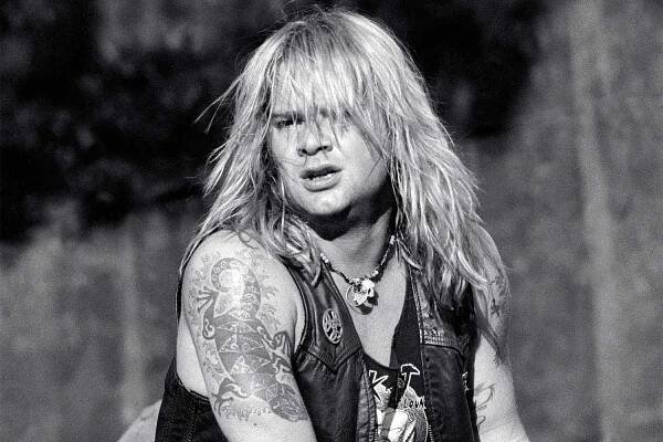 Lead singer David Roach is shown performing on stage during a live concert appearance with Junkyard on July 28, 1991 in Bristol, Connecticut.