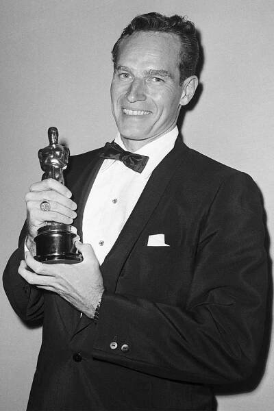 Charlton Heston holding his Best Actor Oscar after the 32nd annual Academy Awards on April 4, 1960