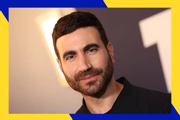Brett Goldstein smirks at the camera.