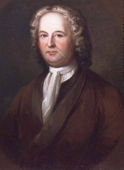 This color portrait shows James Logan. He wears a brown coat, white scarf and powdered wig.