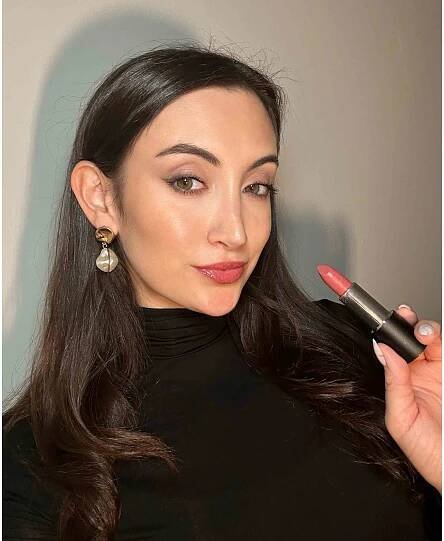 Person testing the makeup by mario lipstick