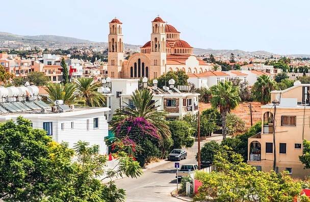 Panorama of Paphos in Cyprus, colorful vegetation and city buildings