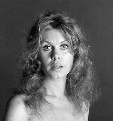 black and white photograph of a woman with very large breast