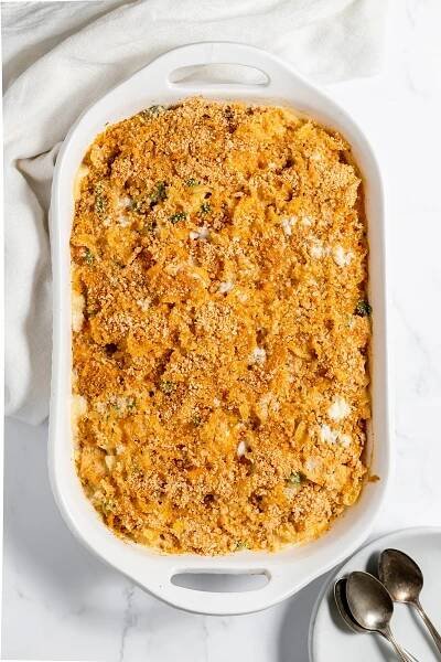 Baked chicken noodle casserole cooling in white baking dish.