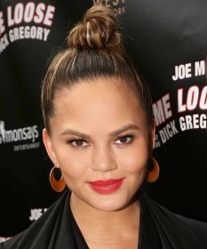 Chrissy Teigen poses at The Opening Night of 'Turn Me Loose' at The Westside Theatre on May 19, 2016 in New York City.