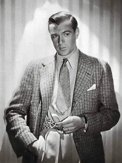 Gary Cooper In A Tweed Jacket With White Pants And Pocket Square