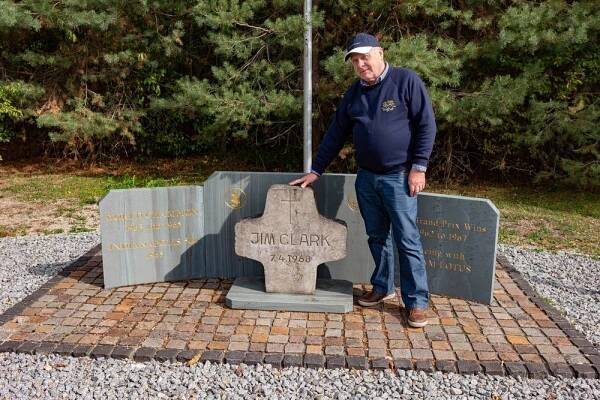   Jim Clark’s most ardent fan, John, with the new memorial on the edge of the race circuit. The central cross was moved from the original scene of the accident when the circuit was shortened in 2002. Most visitors will now assume that this is the site of the fatal accident  