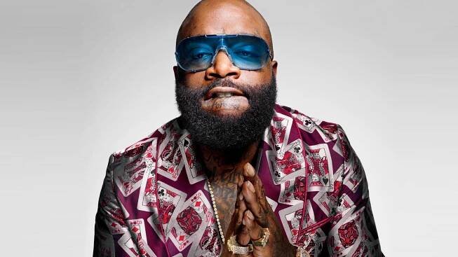 This image may contain Face Human Person Rick Ross Sunglasses Accessories Accessory Beard and Man